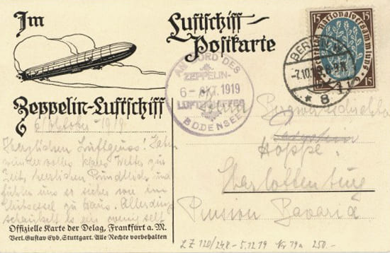 Zeppelinpost: Eine Luftschiff-Postkarte mit handschriftlichem Text und Poststempeln